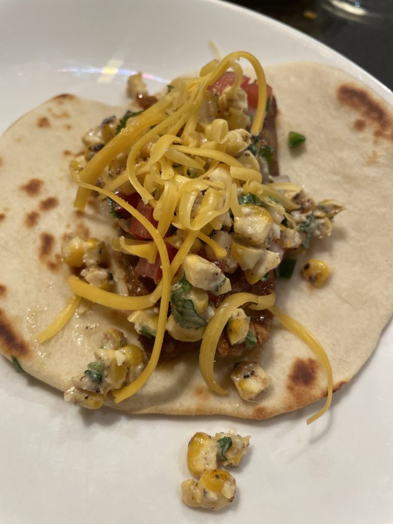 steak taco with toppings from a cooking class on an Eastside Seattle day date